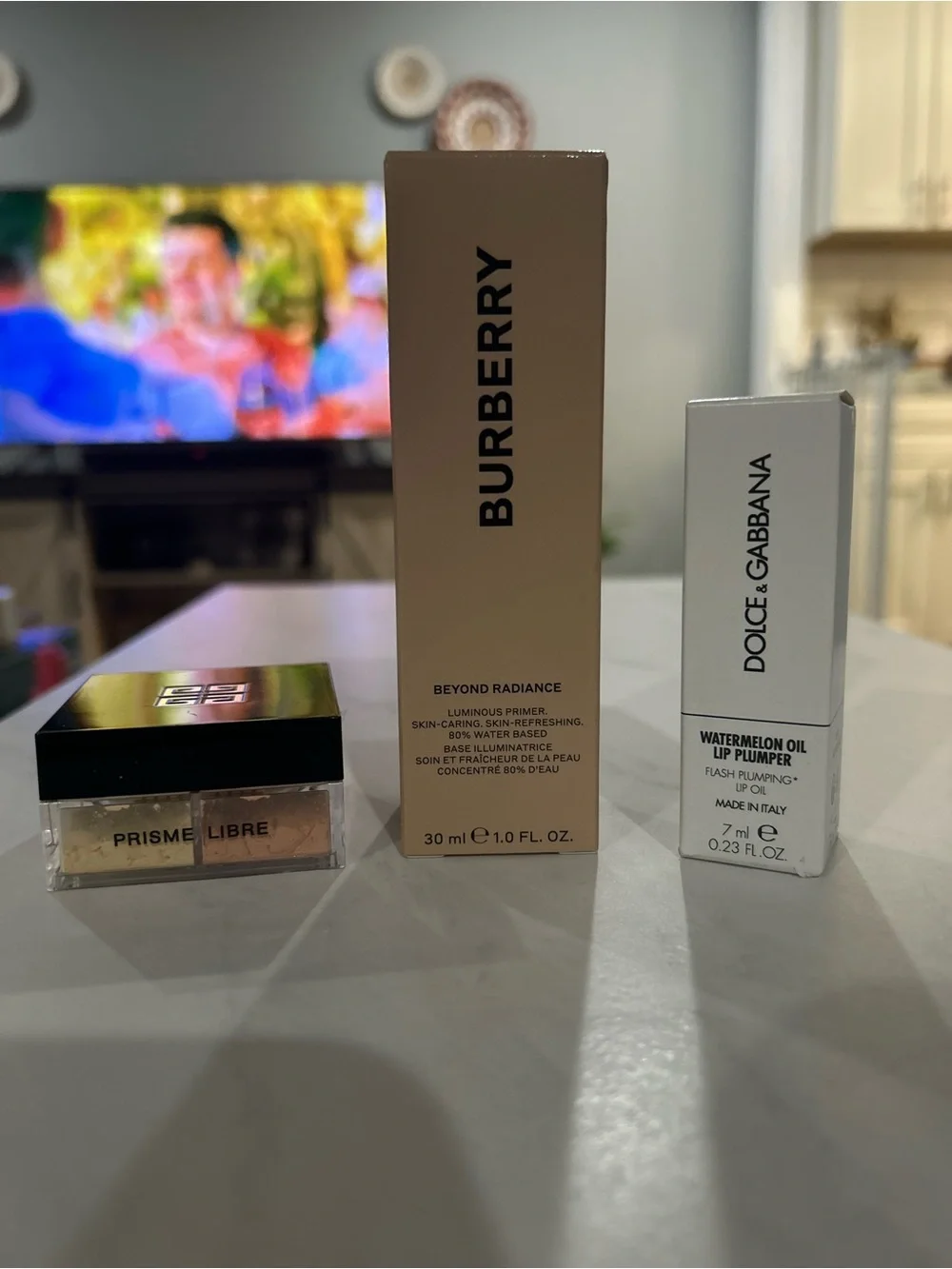 Givenchy Powder, Burberry Primer, Dolce & Gabbana Lip Plumper